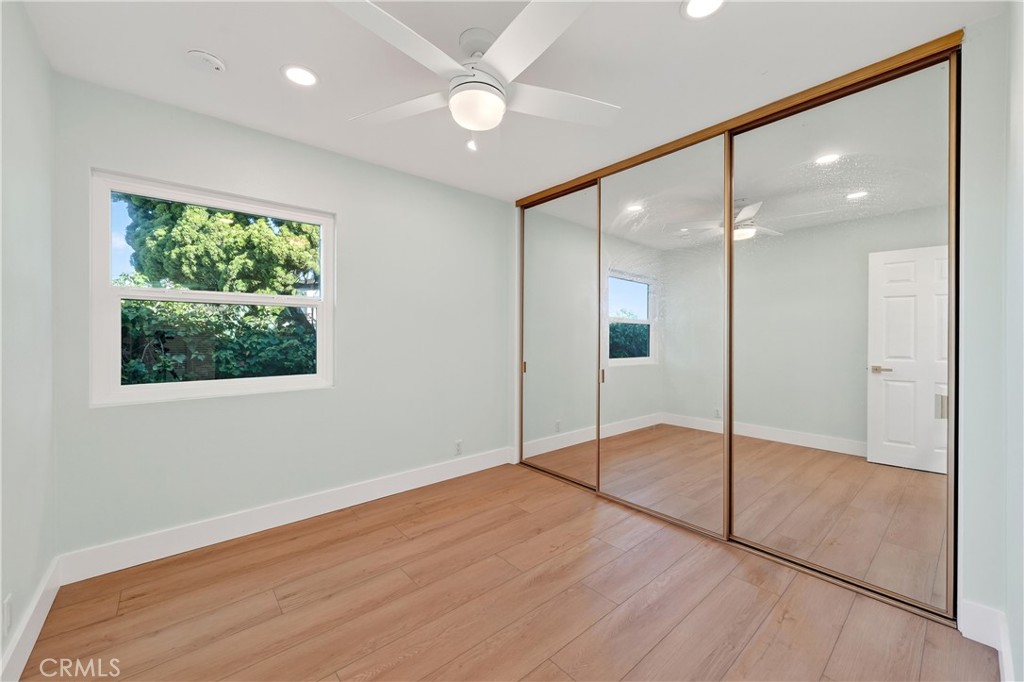 34381 Dana Strand Road, Unit 2 Dana Point, CA 92629 - Photo 15 of 42 a view of an empty room with wooden floor and a window