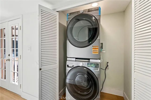 a view of a hallway with washer and dryer
