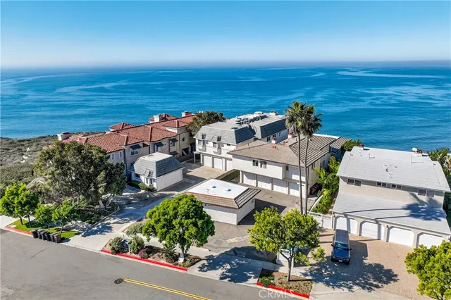 an aerial view of a house with a lake view