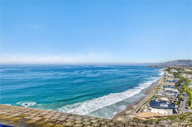 a view of a house with wooden fence