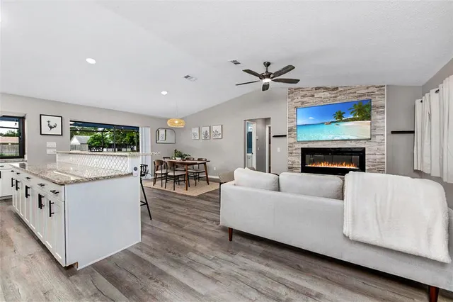 a living room with furniture and a fireplace