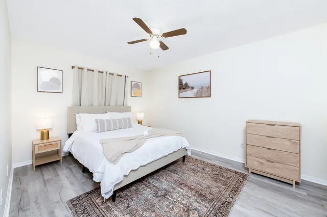 a bedroom with a bed and a dresser