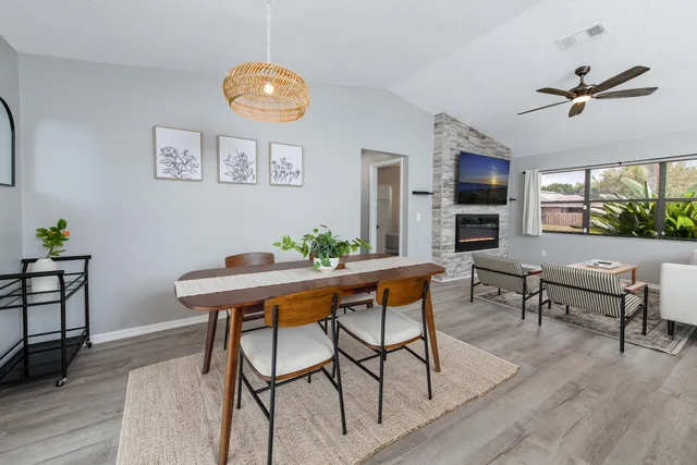 a view of a dining room with furniture window and wooden floor