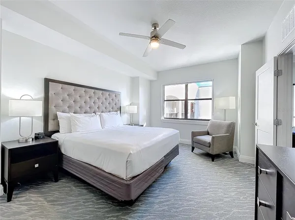 a bedroom with a bed and window