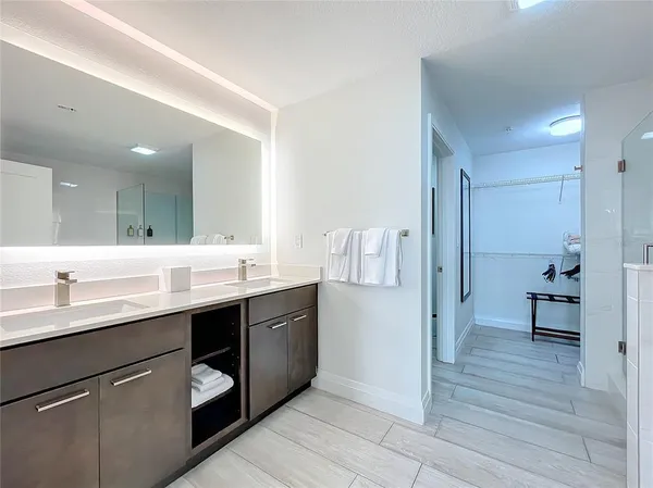 a kitchen with a sink and a refrigerator