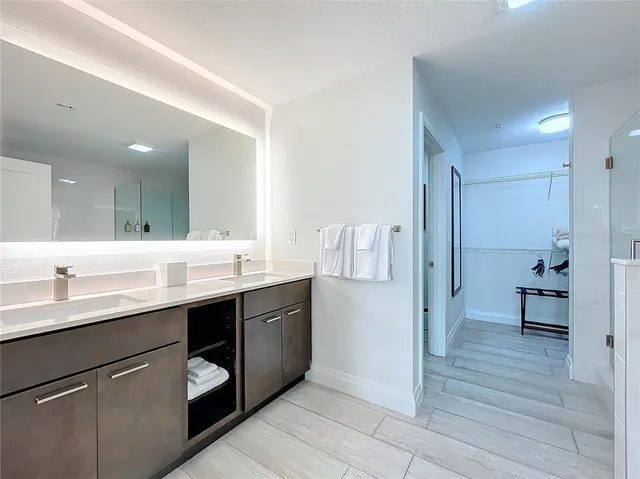 a kitchen with a sink and a refrigerator