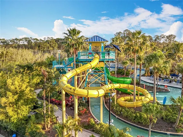 view of swimming pool with outdoor seating and city view