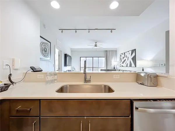 a kitchen with a sink and a refrigerator