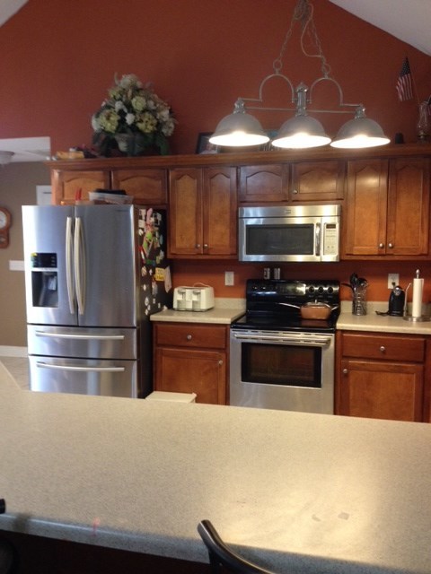 331 Lite-N-Tie Road Gray, GA 31032 - Photo 3 of 15 a kitchen with granite countertop a refrigerator and a stove