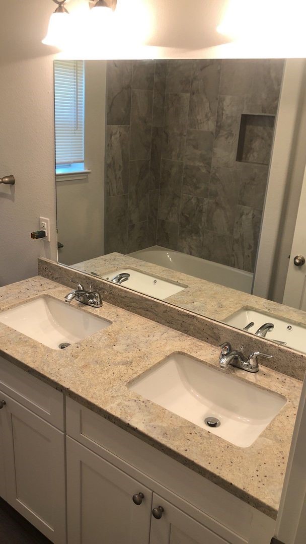 8218 Parker Road, Unit A Houston, TX 77078 - Photo 5 of 18 a bathroom with a sink and a mirror