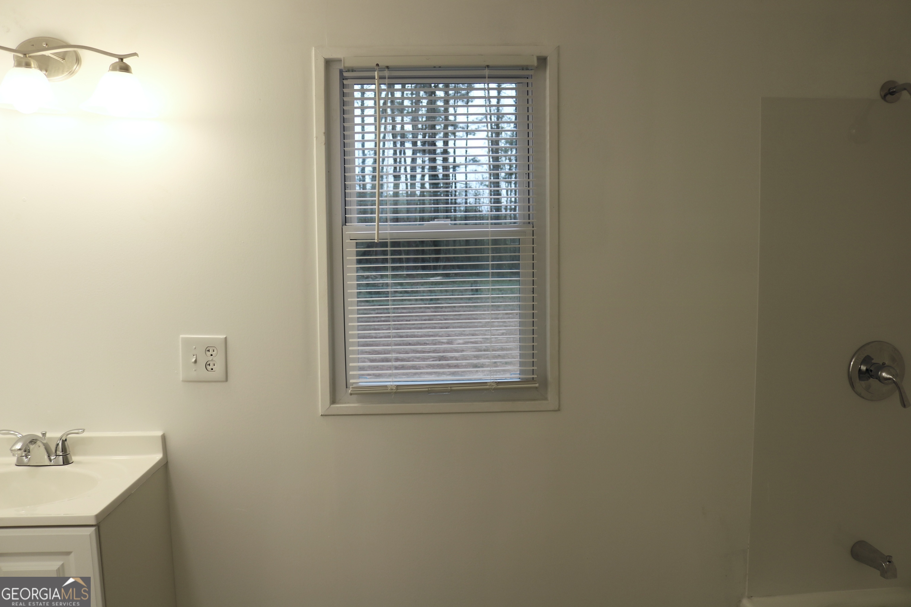 135 Chase Road LaGrange, GA 30241 - Photo 13 of 20 a bathroom with a sink and a window