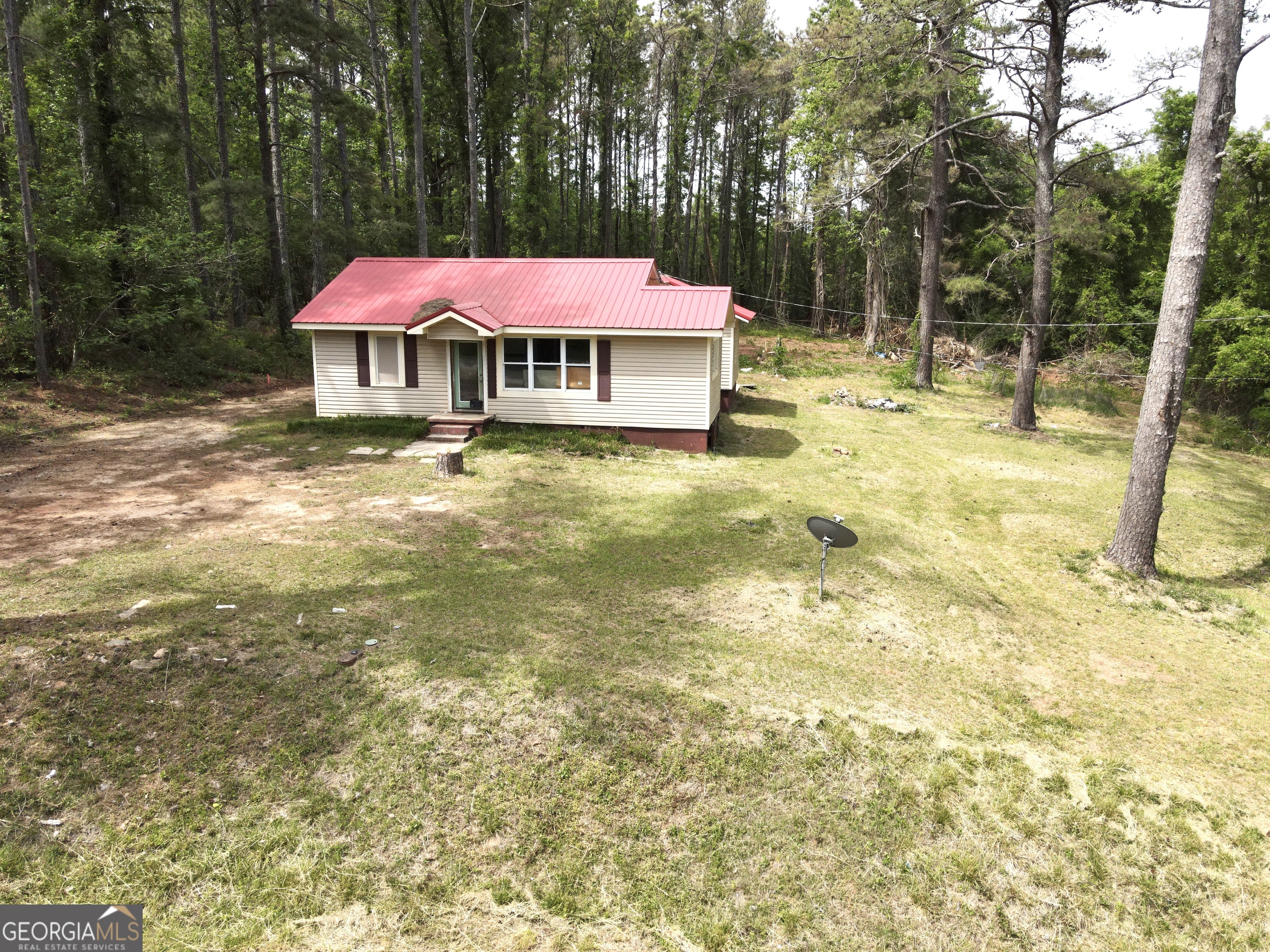135 Chase Road LaGrange, GA 30241 - Photo 3 of 20 a large swimming pool with red umbrella