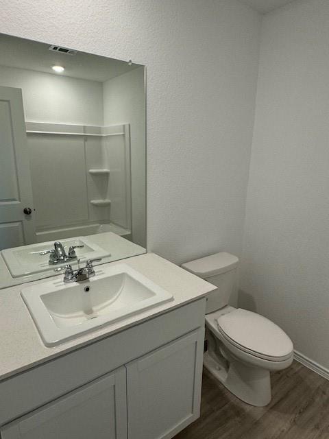 752 Soapstone Pass Maxwell, TX 78656 - Photo 4 of 8 a bathroom with a sink toilet and mirror