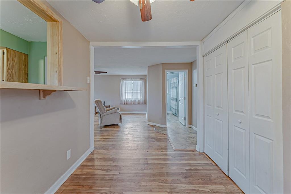 67 Noblestown Road Carnegie, PA 15106 - Photo 11 of 24 a hallway with wooden floor windows and livingroom