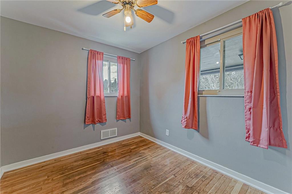 67 Noblestown Road Carnegie, PA 15106 - Photo 16 of 24 a view of a room with wooden floor and a window