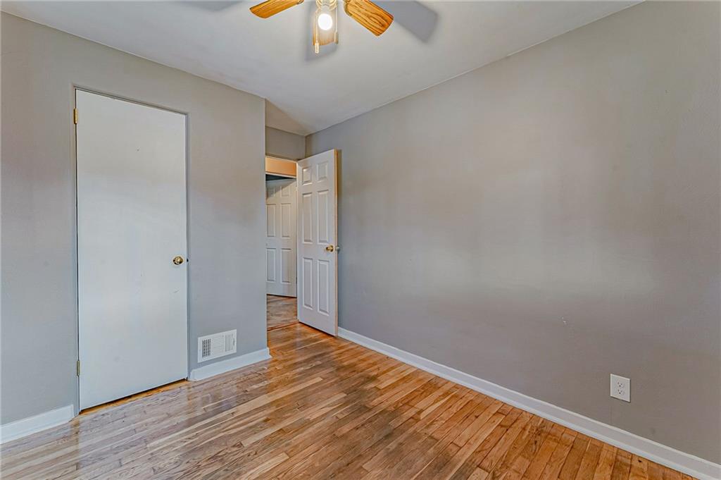 67 Noblestown Road Carnegie, PA 15106 - Photo 17 of 24 a view of an empty room with wooden floor and chandelier