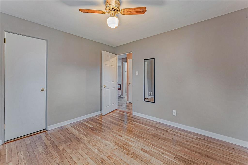 67 Noblestown Road Carnegie, PA 15106 - Photo 19 of 24 wooden floor in an empty room with a window