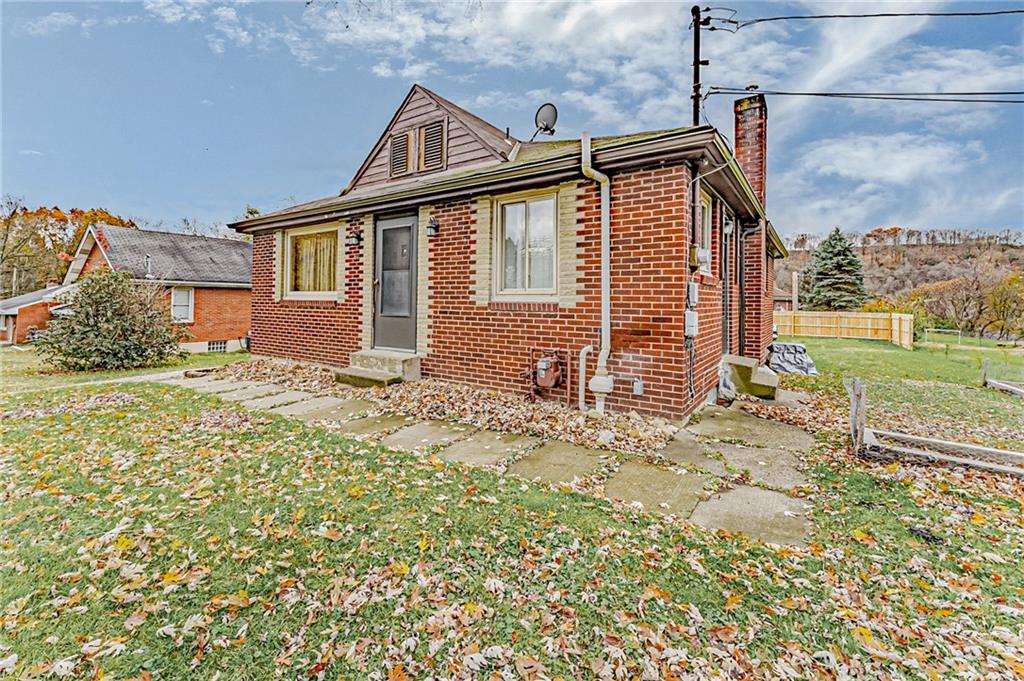 67 Noblestown Road Carnegie, PA 15106 - Photo 3 of 24 a front view of a house with a yard