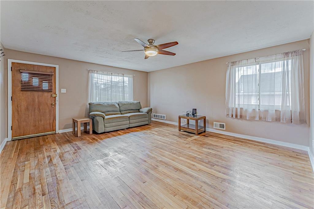 67 Noblestown Road Carnegie, PA 15106 - Photo 5 of 24 a living room with furniture and a wooden floor