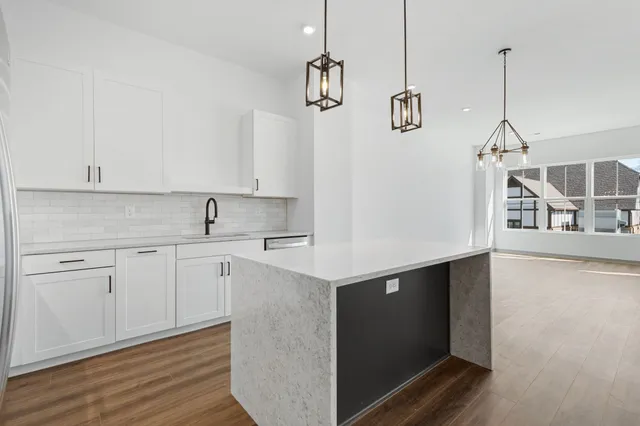 a kitchen with a sink cabinets and window