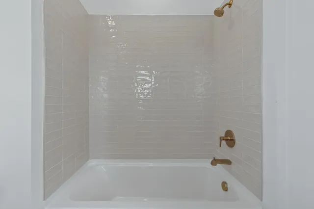 a bathroom with a double vanity sink and mirror