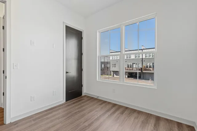 a kitchen with stainless steel appliances a sink a refrigerator a stove a microwave and cabinets