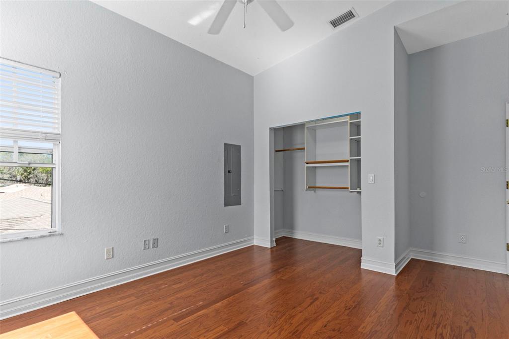 8229 Gulf Way Hudson, FL 34667 - Photo 31 of 35 wooden floor in an empty room with a window