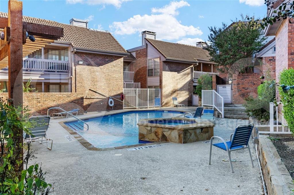 18240 Midway Road, Unit 1204 Dallas, TX 75287 - Photo 15 of 27 Resort-style swimming pool with an integrated spa, surrounded by a concrete deck