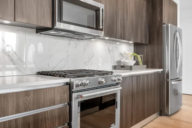 a kitchen with a stove and a microwave