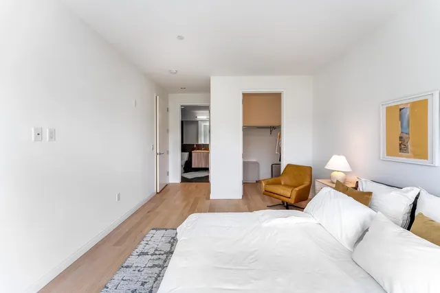 a bedroom with a bed and closet