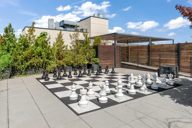 a view of a terrace with chairs and potted plants