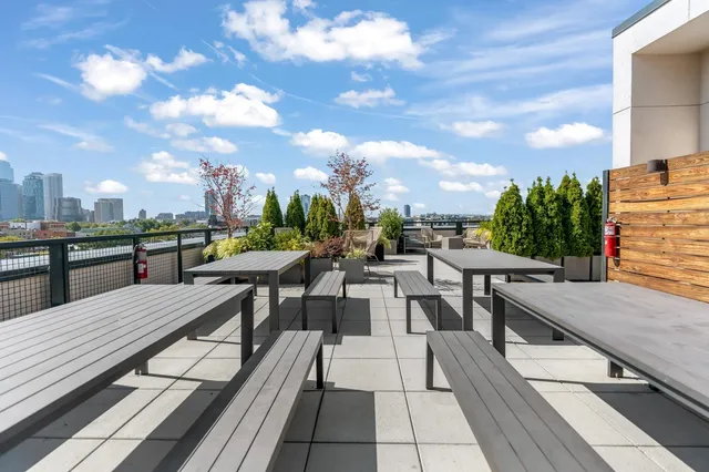 a view of a terrace with seating and furniture