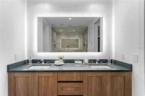 a bathroom with a bathtub and shower