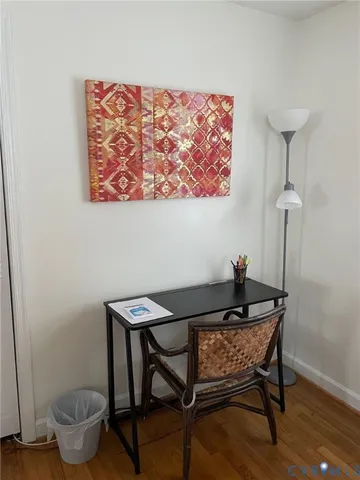 a bedroom with a bed and a chair