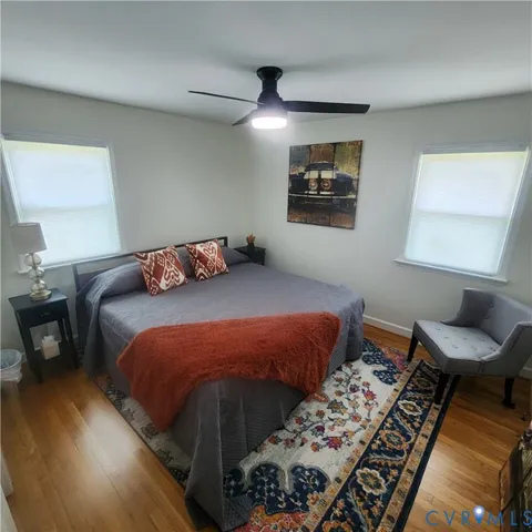 a living room with furniture and a bed