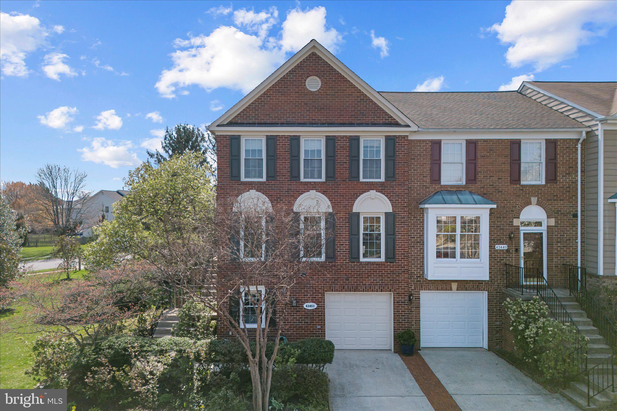 43451 Livery Square Ashburn, VA 20147 - Photo 1 of 51 a front view of a house with a yard