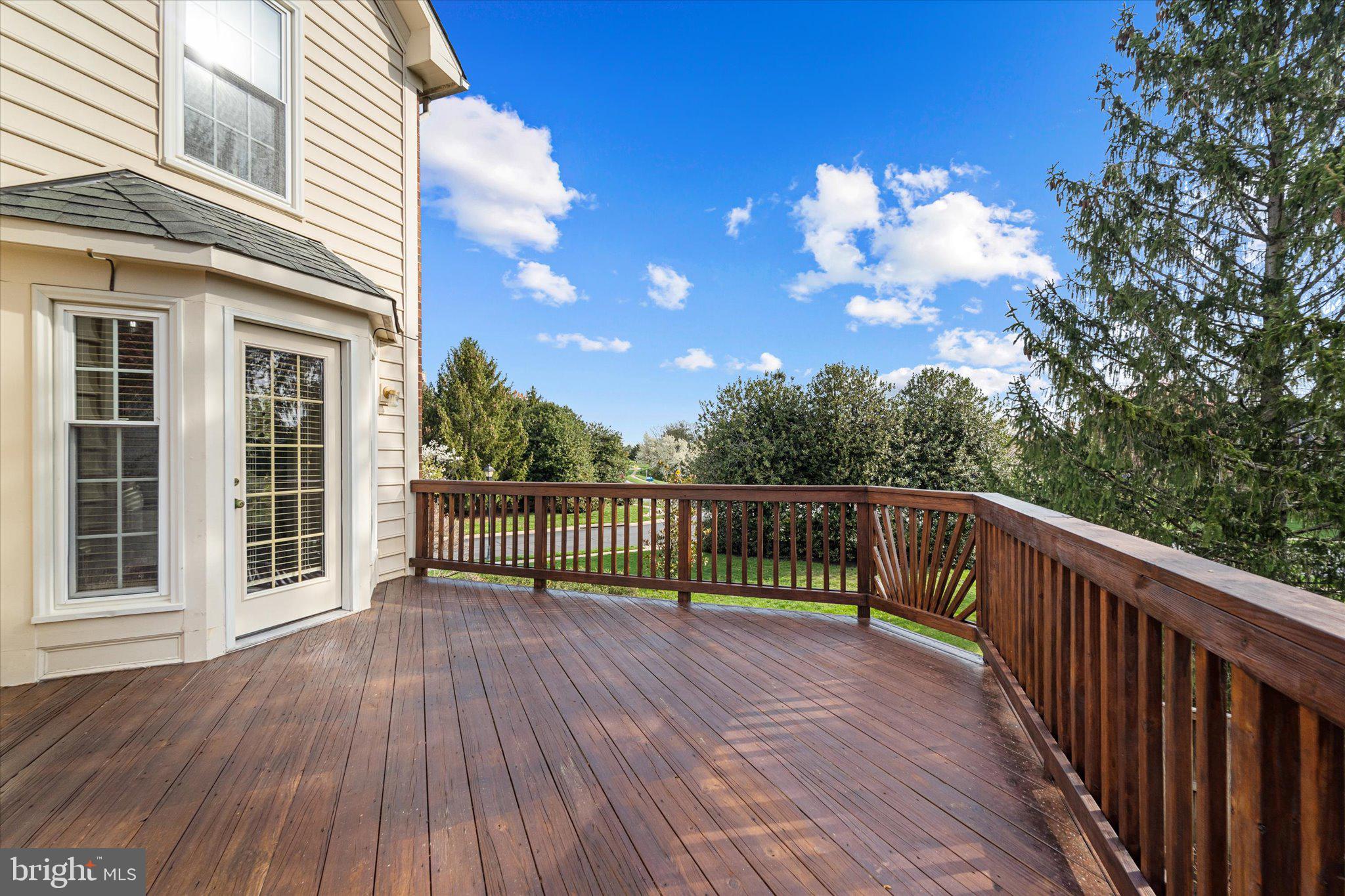 43451 Livery Square Ashburn, VA 20147 - Photo 17 of 51 a view of balcony with wooden floor and fence