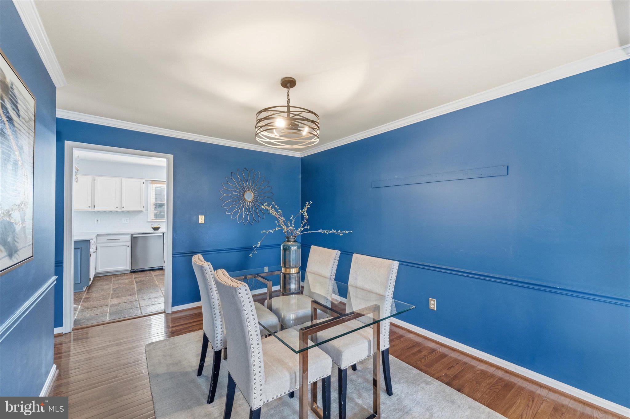 43451 Livery Square Ashburn, VA 20147 - Photo 21 of 51 a view of a dining room with furniture and chandelier