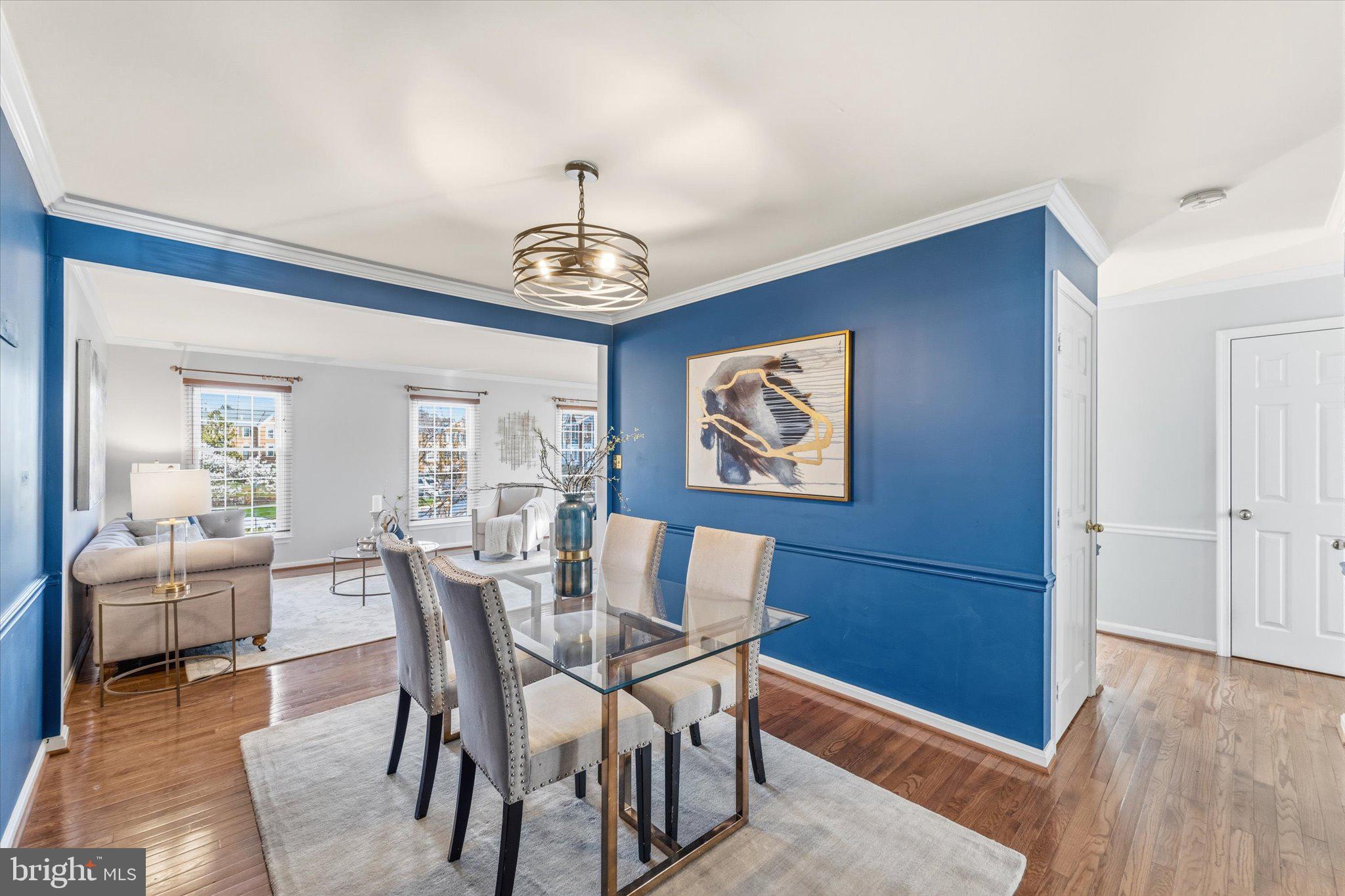 43451 Livery Square Ashburn, VA 20147 - Photo 23 of 51 a view of a dining room with furniture wooden floor and chandelier