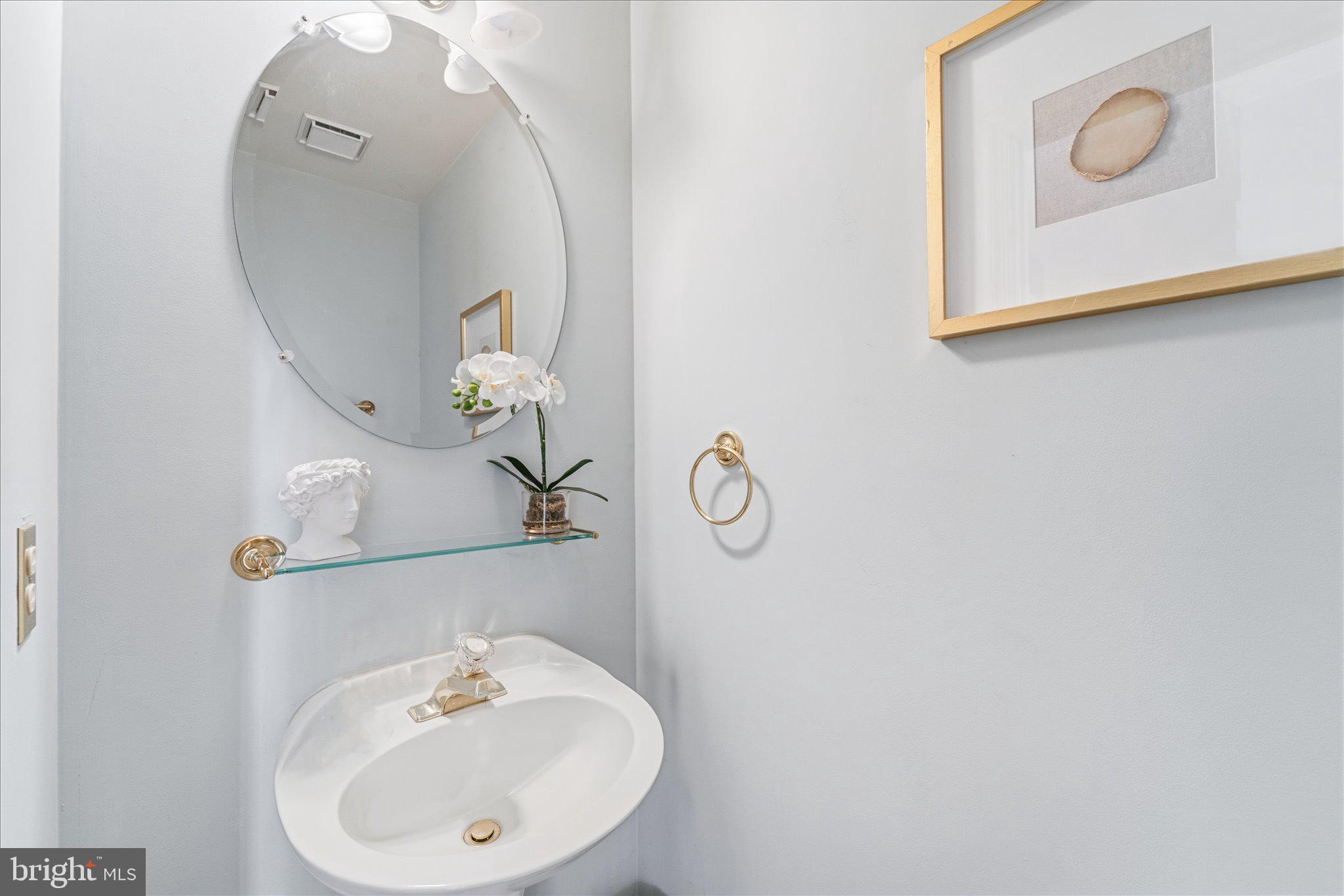 43451 Livery Square Ashburn, VA 20147 - Photo 24 of 51 a bathroom with a sink and mirror