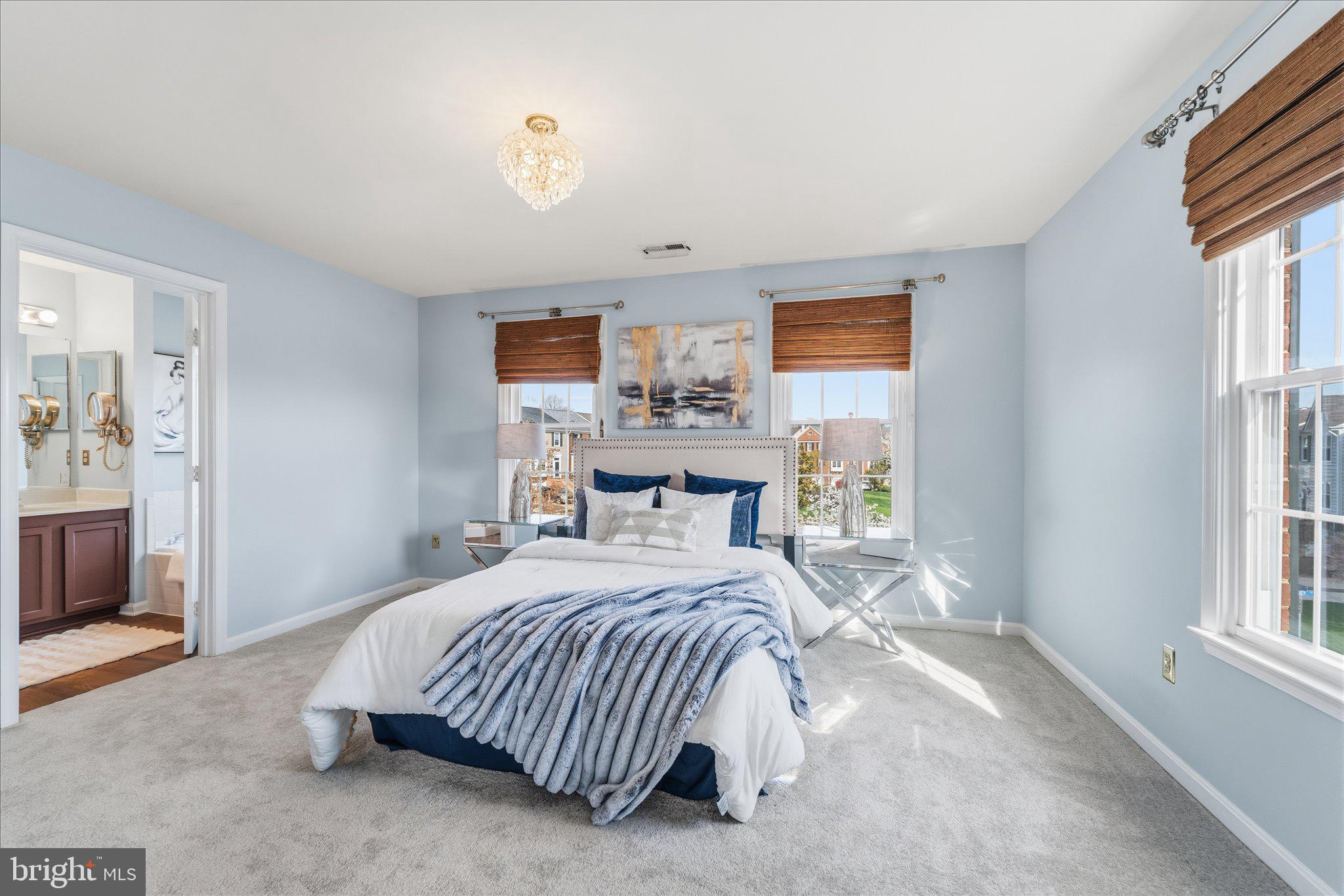 43451 Livery Square Ashburn, VA 20147 - Photo 27 of 51 a bedroom with a bed and a window