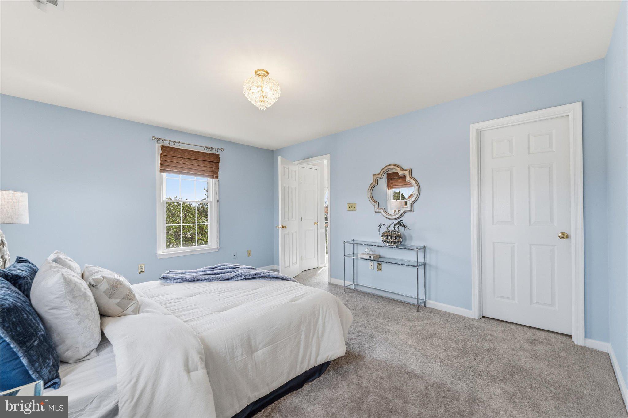 43451 Livery Square Ashburn, VA 20147 - Photo 28 of 51 a spacious bedroom with a bed and window
