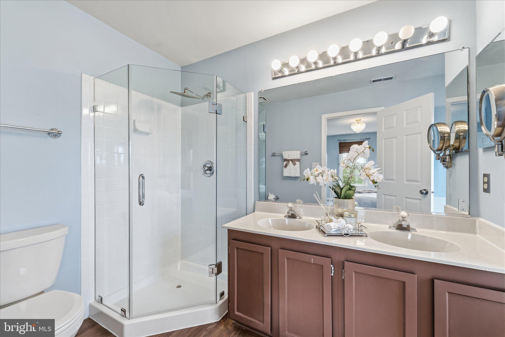 43451 Livery Square Ashburn, VA 20147 - Photo 29 of 51 a bathroom with a shower sink and mirror