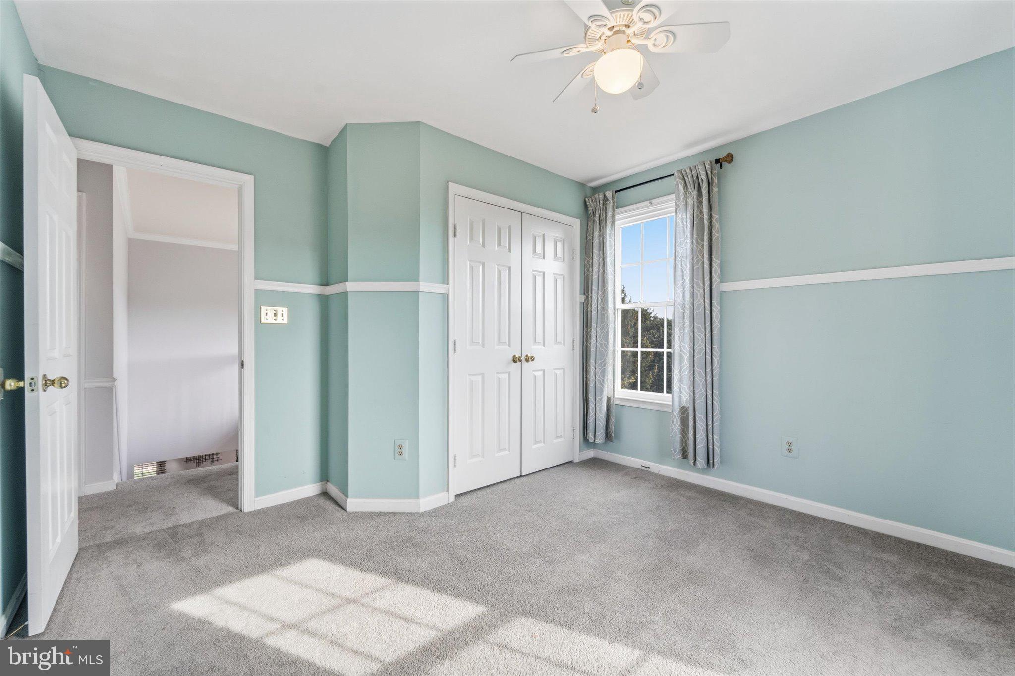 43451 Livery Square Ashburn, VA 20147 - Photo 33 of 51 a view of a big room with windows and chandelier fan