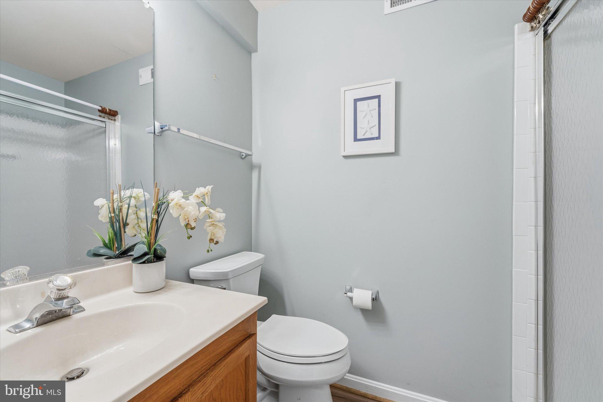 43451 Livery Square Ashburn, VA 20147 - Photo 42 of 51 a bathroom with a sink vanity and toilet