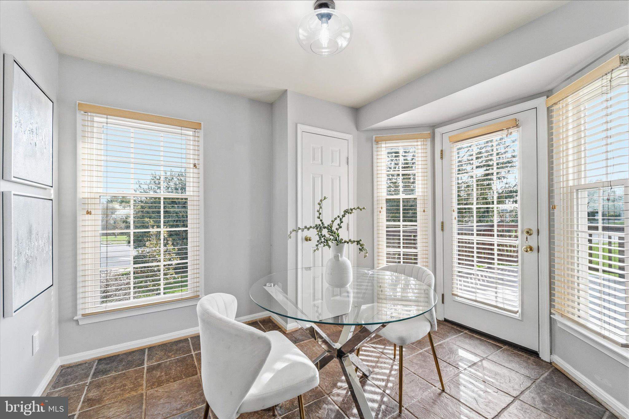 43451 Livery Square Ashburn, VA 20147 - Photo 9 of 51 a dining room with furniture and window