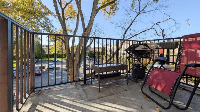 a view of a chairs and tables in the balcony