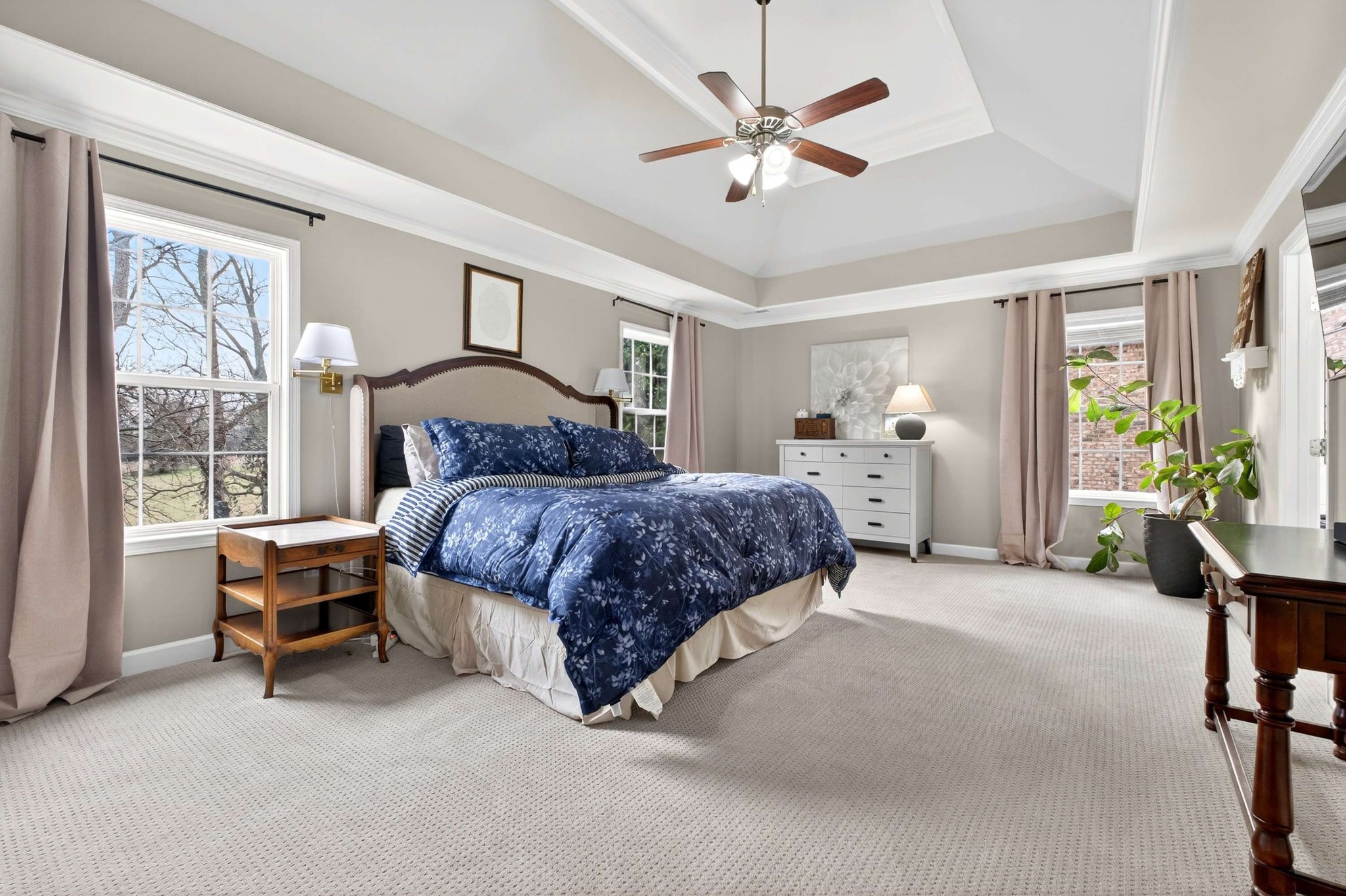 1012 Belcor Drive Spring Hill, TN 37174 - Photo 19 of 40 a spacious bedroom with a bed and a chandelier