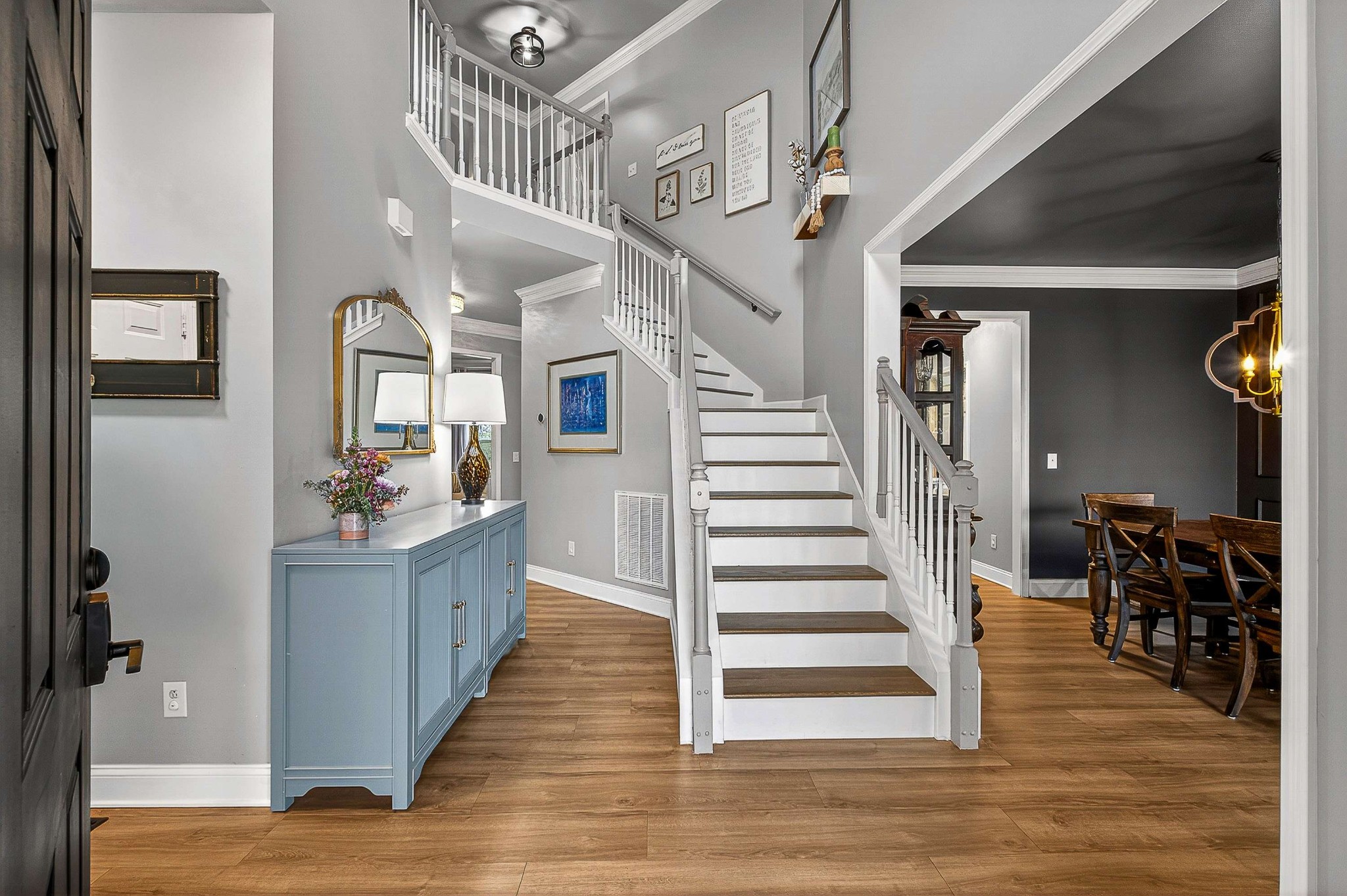 1012 Belcor Drive Spring Hill, TN 37174 - Photo 2 of 40 a view of a hallway with wooden floor and staircase