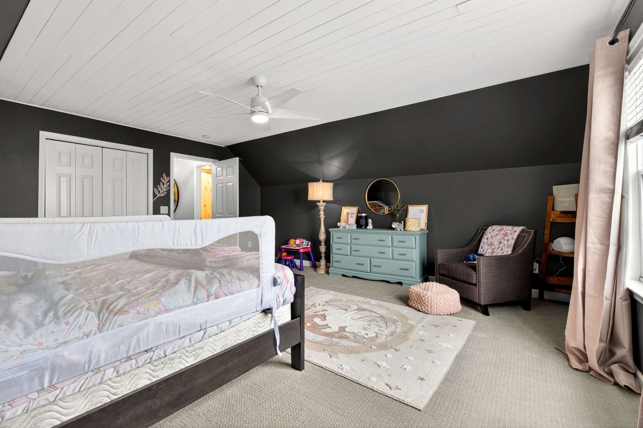 1012 Belcor Drive Spring Hill, TN 37174 - Photo 29 of 40 a spacious bedroom with a bed mirror and window